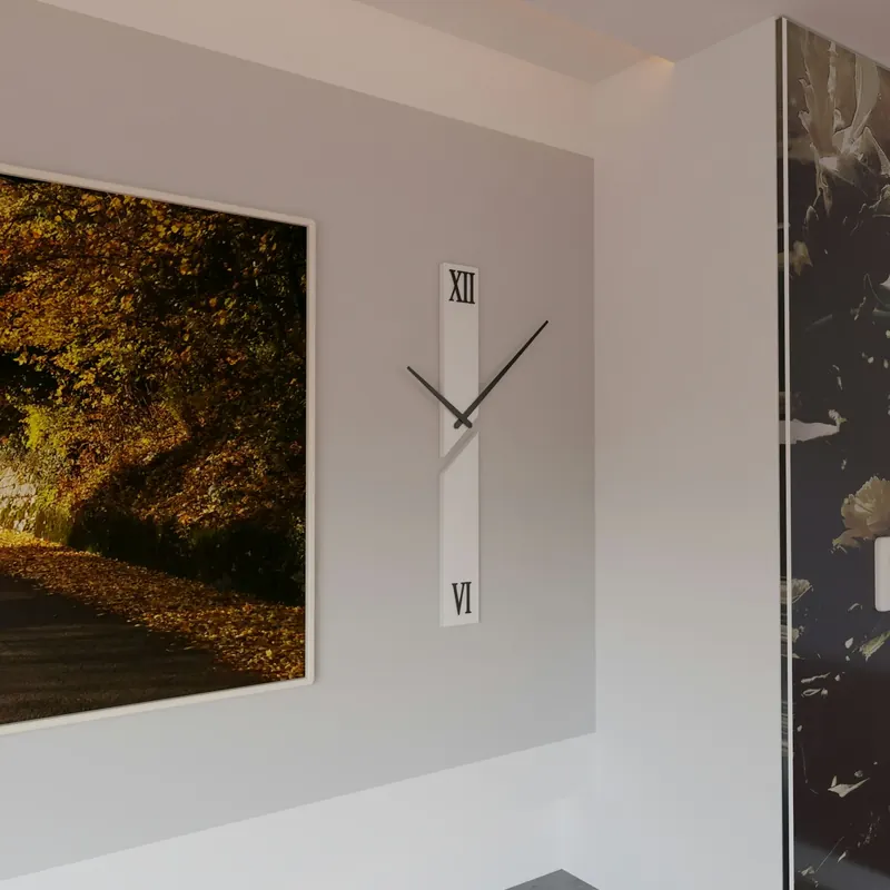 Minimalist wall clock beside framed art